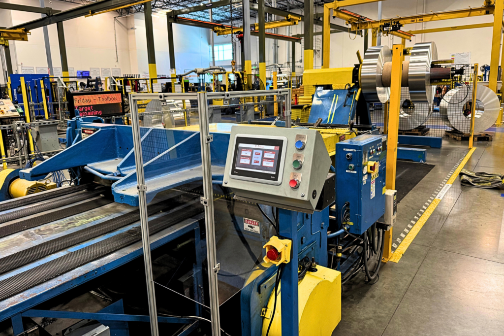 Modernized HMI and control system installed on an existing industrial cut-to-length machine